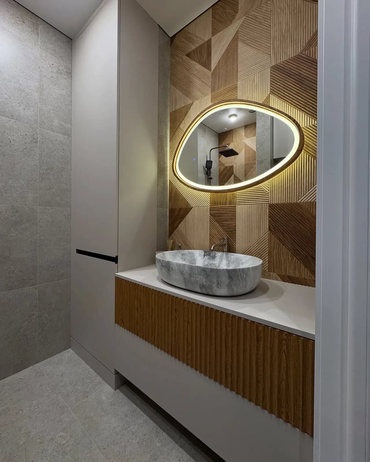 Stone bathroom with marquetry feature wall — Surbiton, London