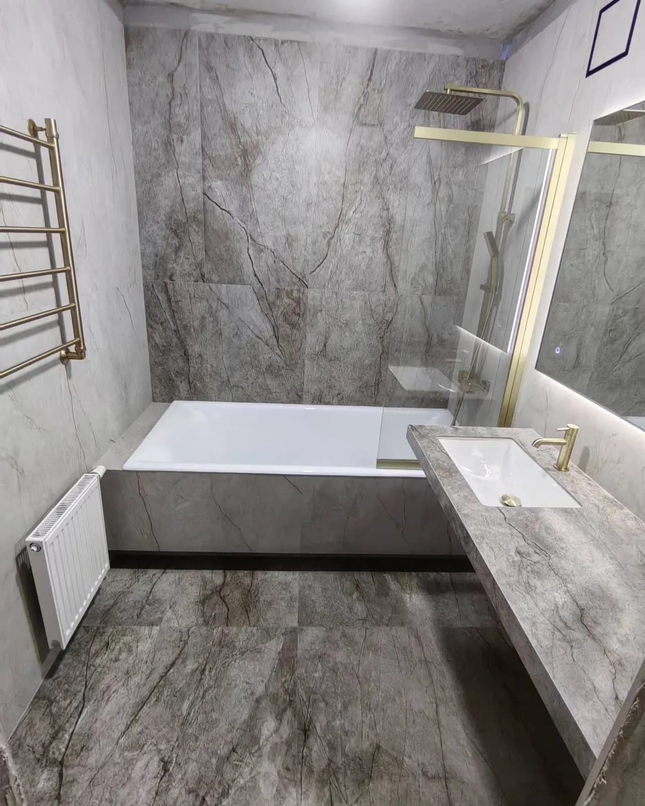 Grey marble bathroom with brushed brass — Croydon, London