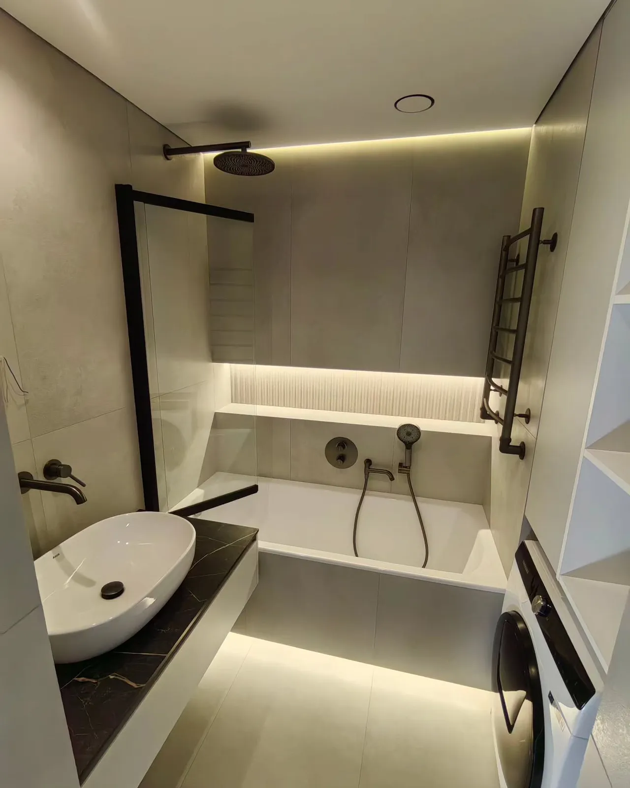 Beige microcement bathroom with black shower — Feltham, London