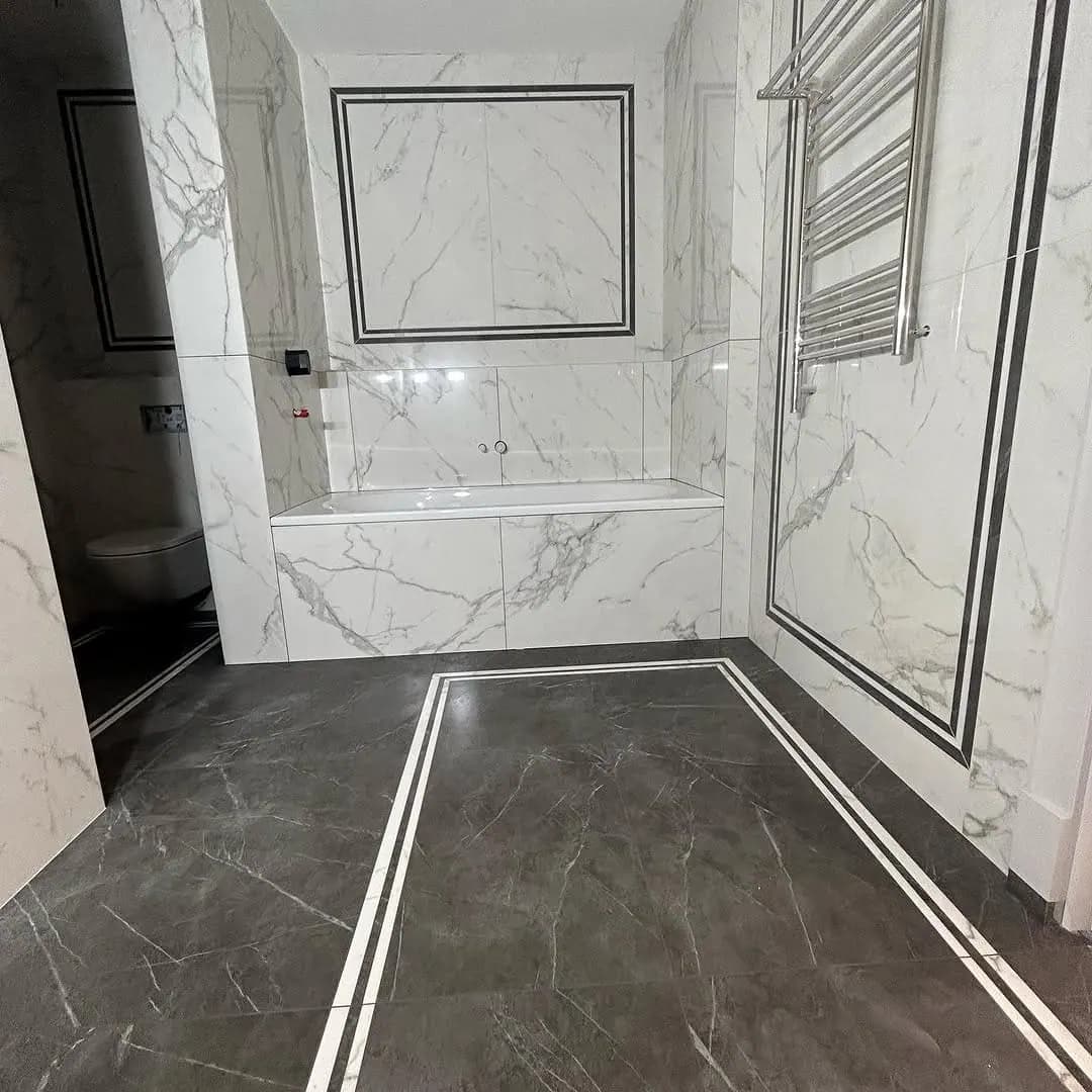 Marble contrast bathroom with inset bath — Enfield Town, London