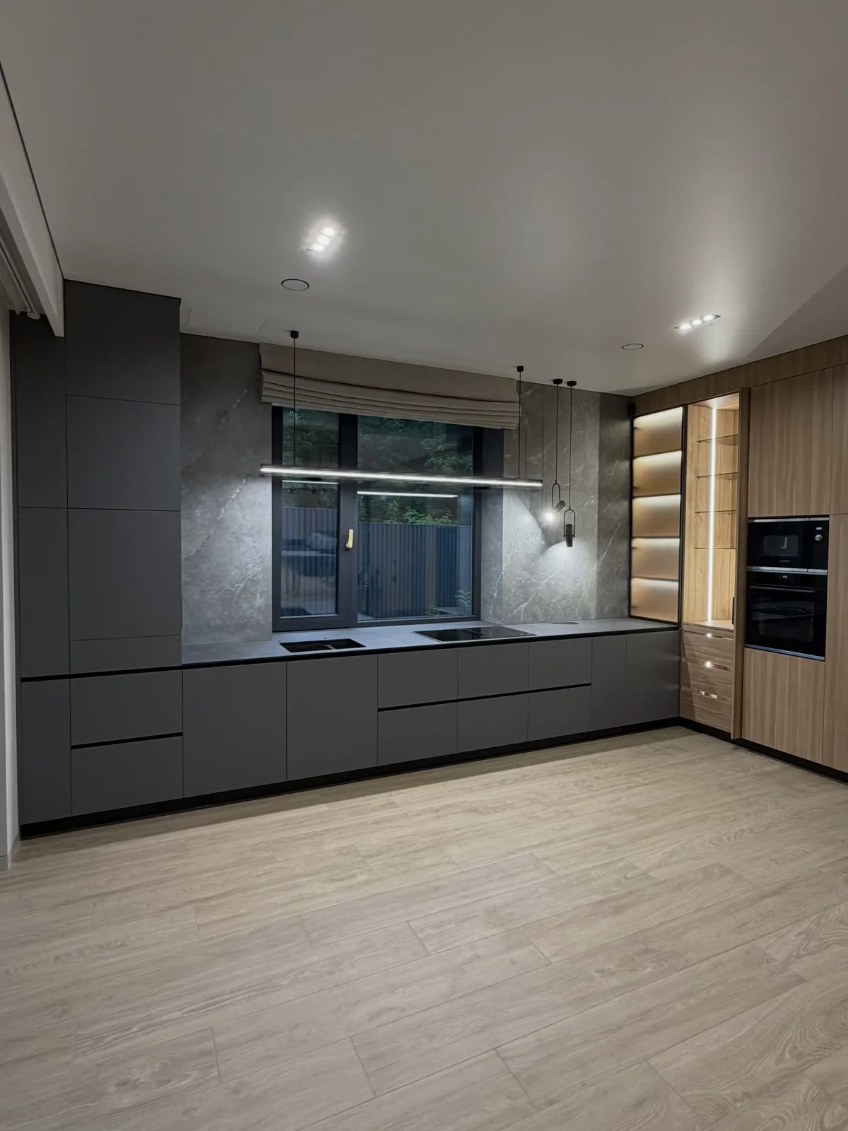 Graphite kitchen with backlit shelving — Harrow, London