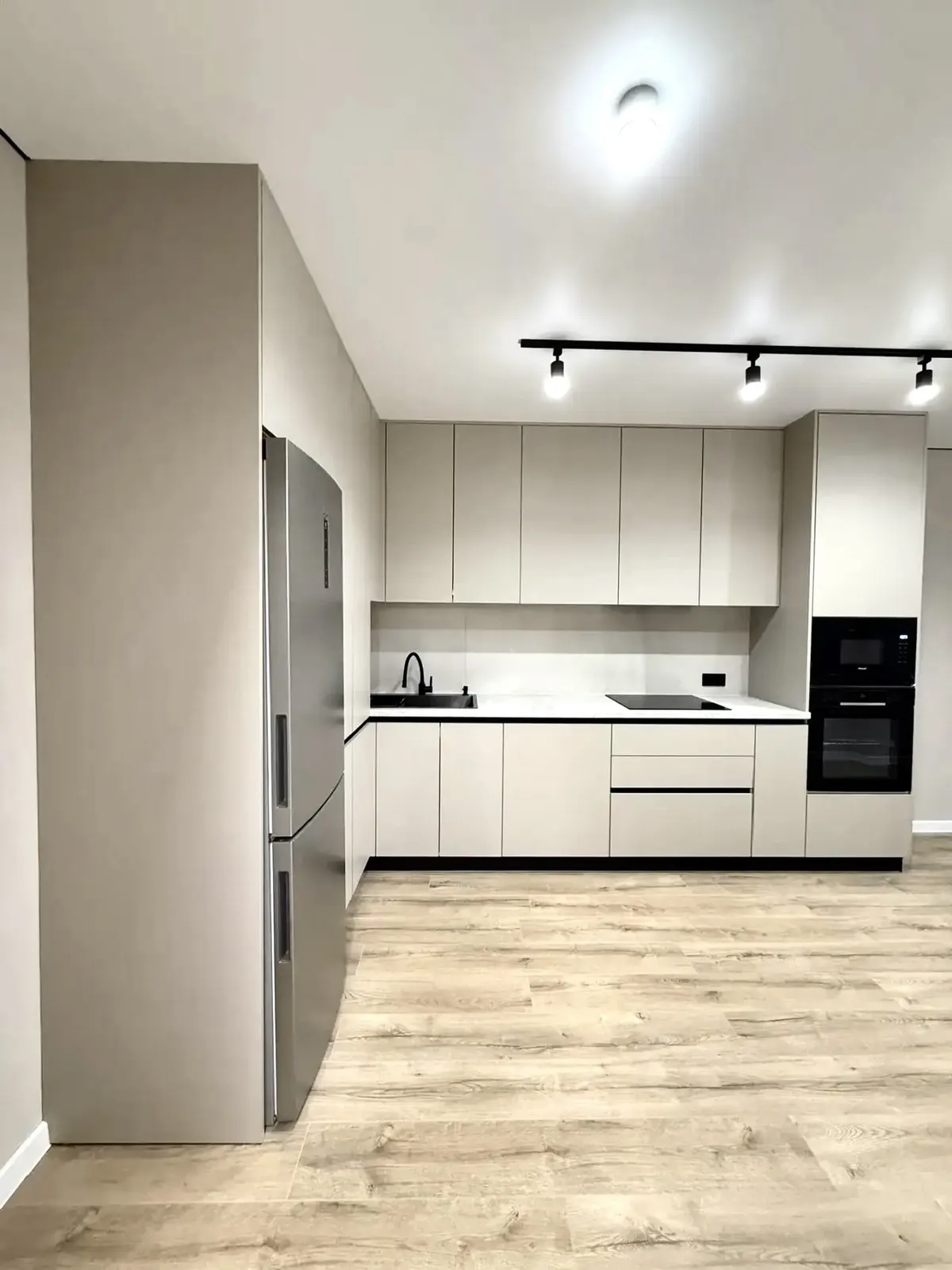 Greige matt kitchen with white stone worktops — Enfield, London