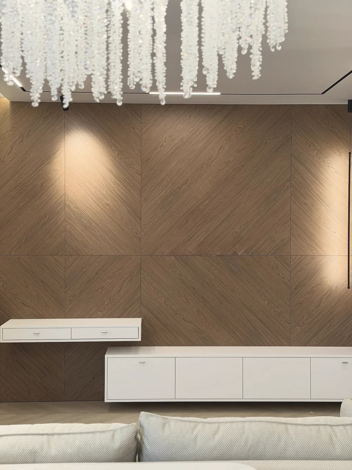 Walnut chevron wall with floating media units — London