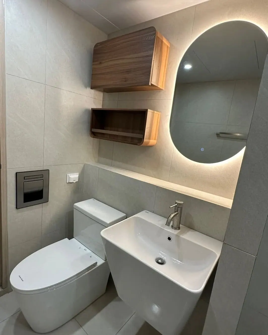 Compact bathroom with backlit mirror — Islington, London
