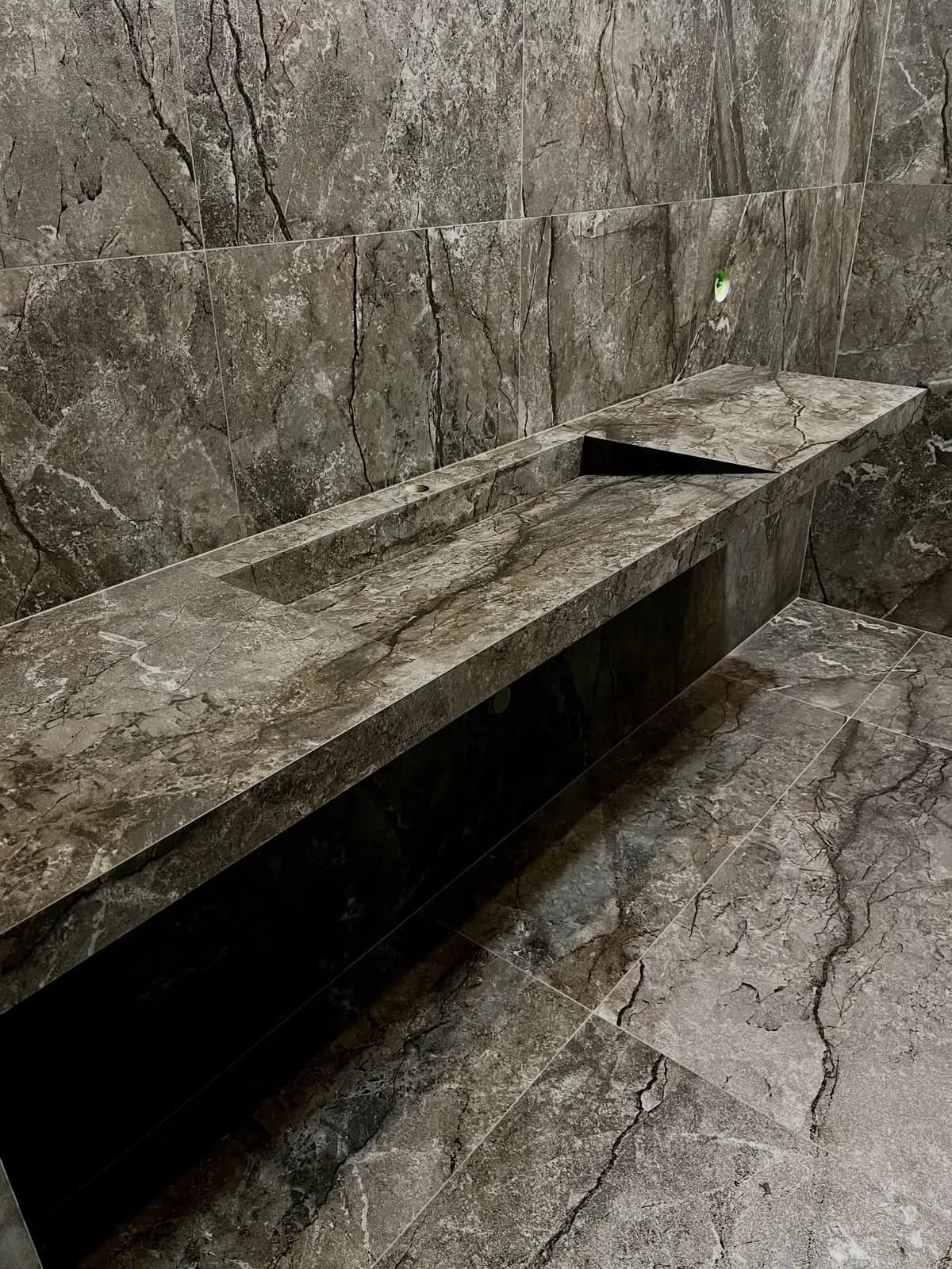 Stone-effect wet room with tiled trough basin — Buckhurst Hill, Essex
