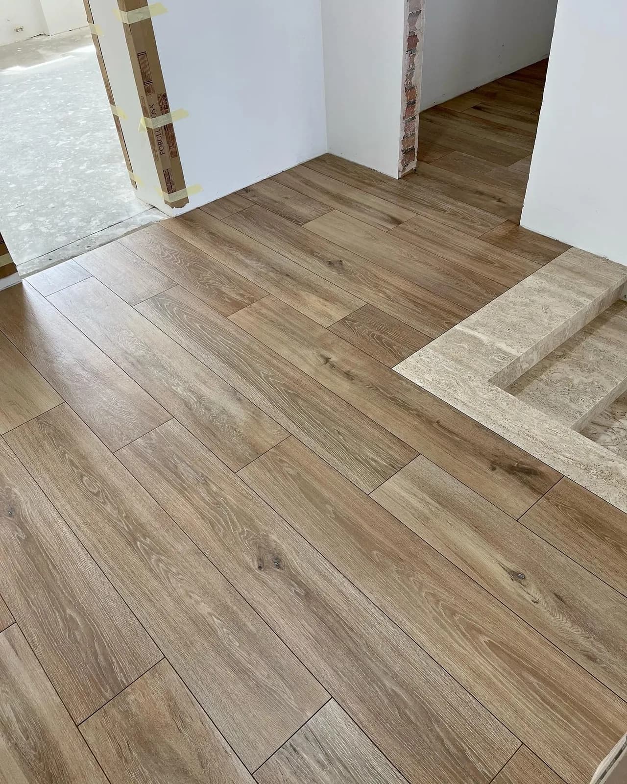Wood-effect floors with travertine borders — Potters Bar, Hertfordshire