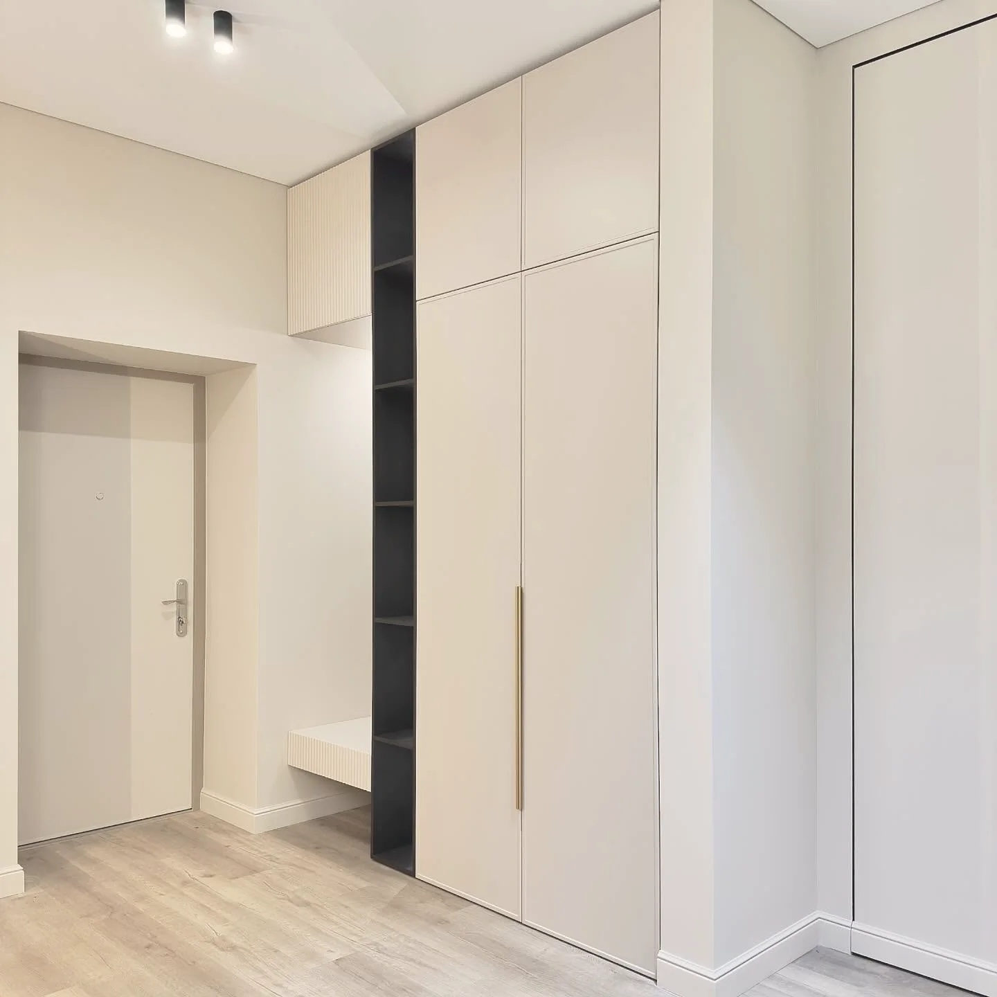 Cream hall wardrobes with seat nook — London