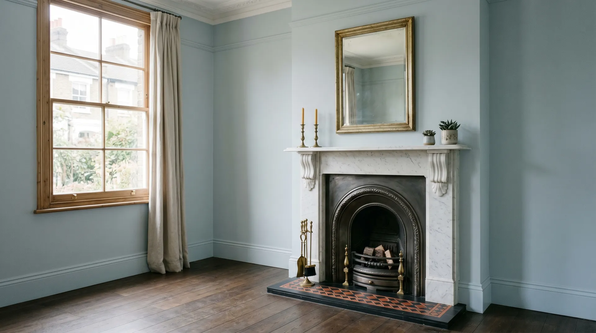 Newly refurbished open-plan London home interior with fitted kitchen, timber flooring and freshly decorated walls after a full strip-out renovation.