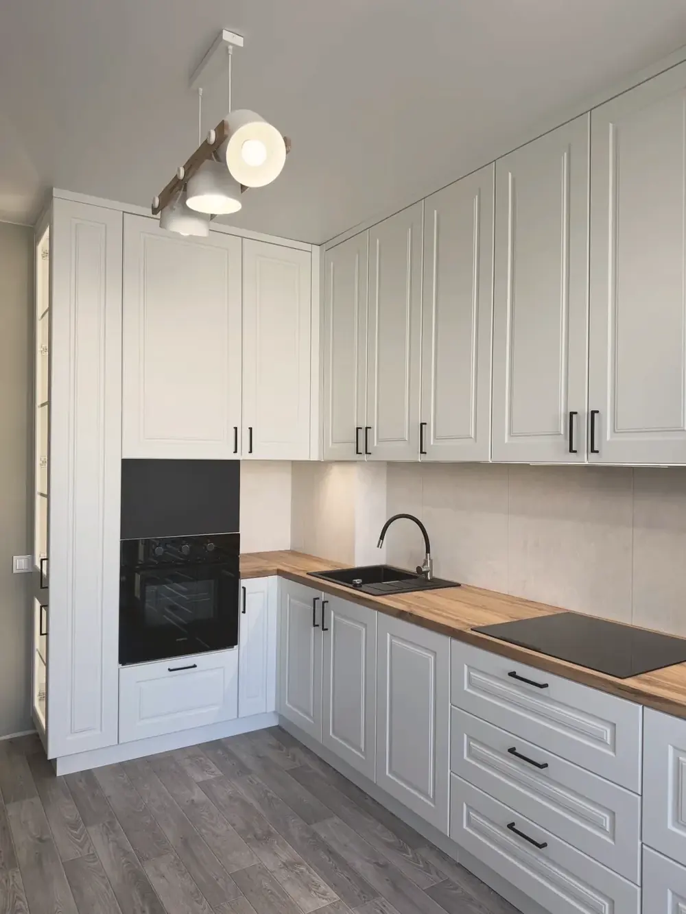 Dove-grey shaker kitchen with wood worktops, completed by PrimeCraft Surface Solutions in Grays, Essex (RM17).