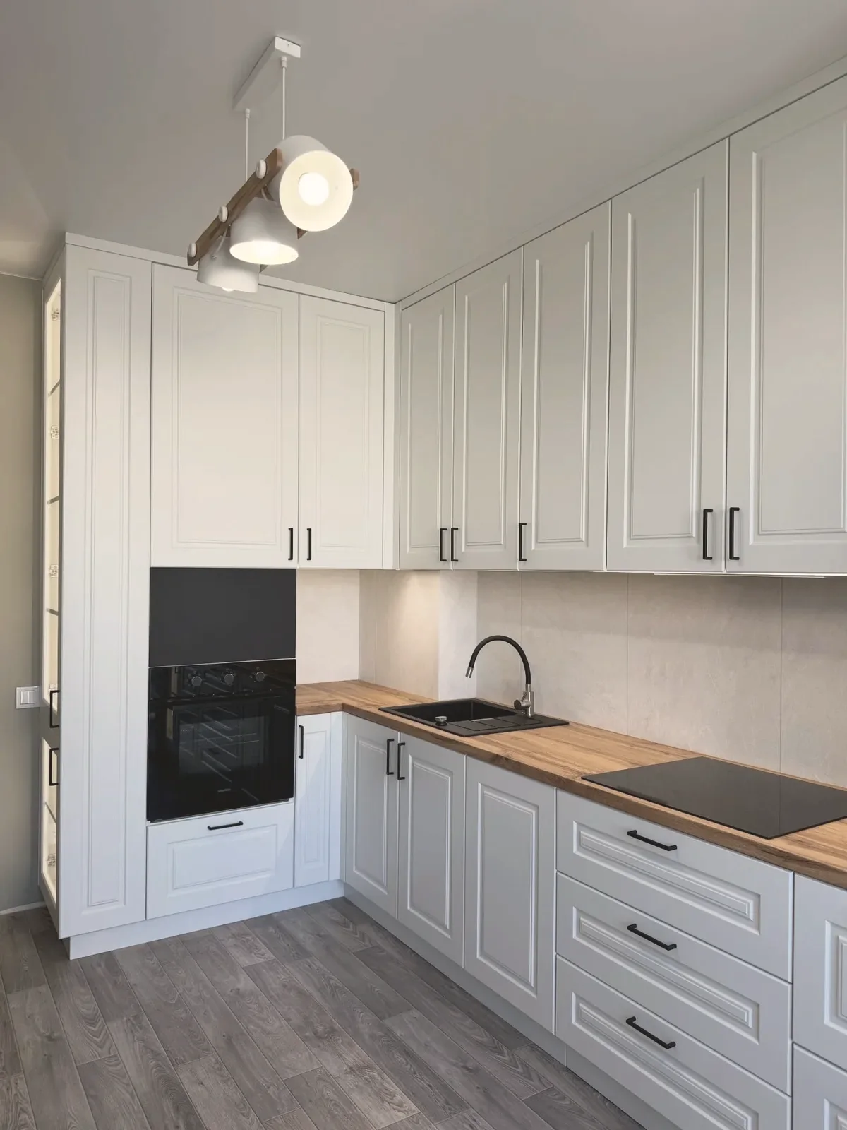 Dove-grey shaker kitchen with wood worktops, completed by PrimeCraft Surface Solutions in Grays, Essex (RM17).