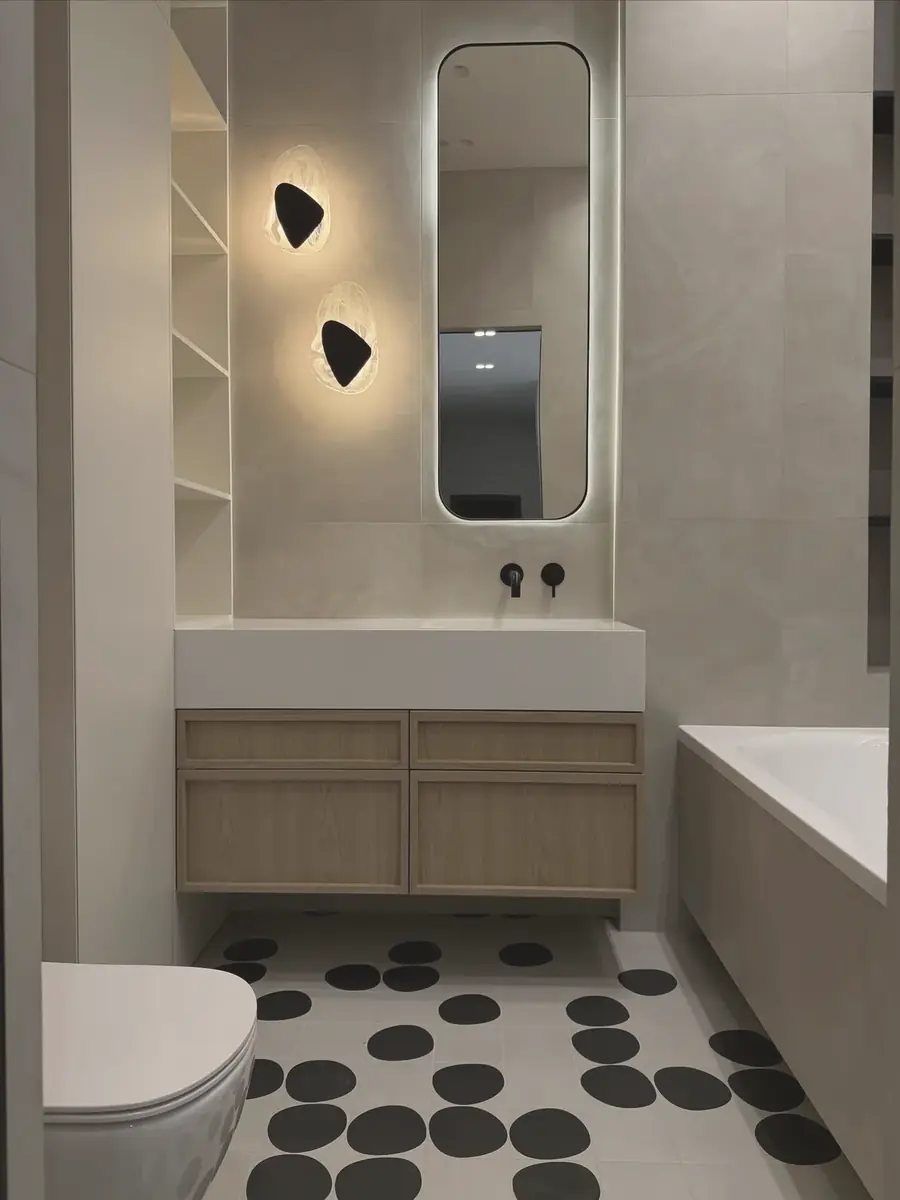 Oak-framed cabinetry and pebble floor — London