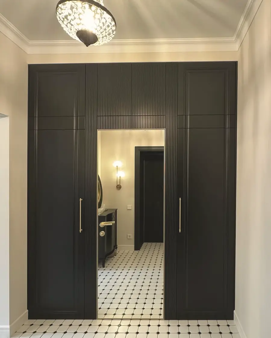 Black fluted hall wardrobes with brass — London
