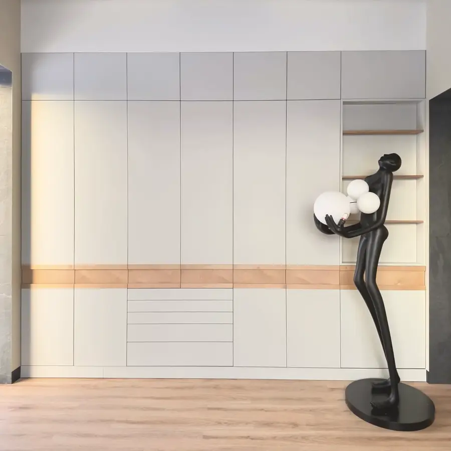 Full-wall storage with oak inlay band — London