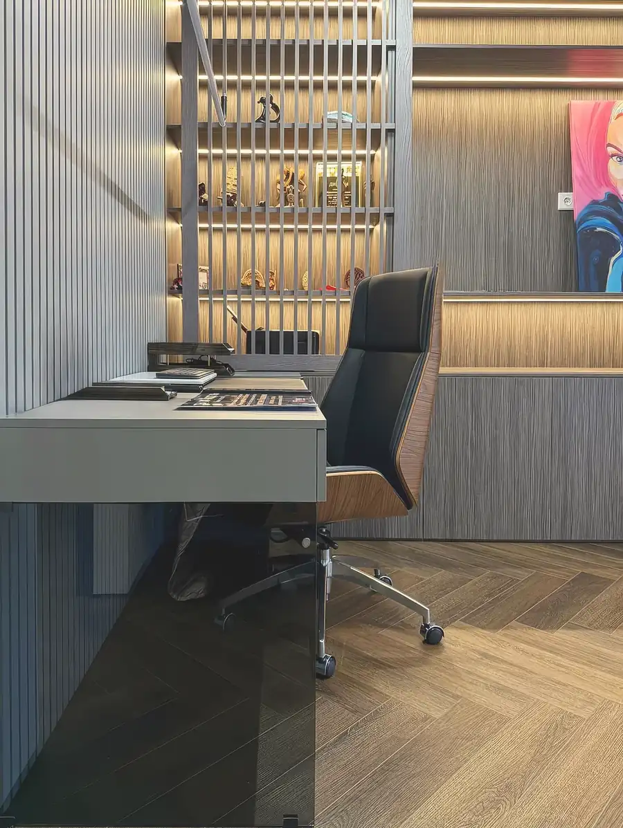 Dark home office with slatted display wall — London