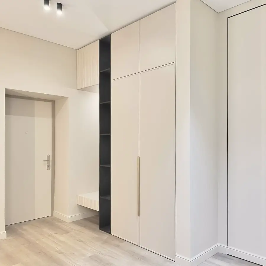 Cream hall wardrobes with seat nook — London