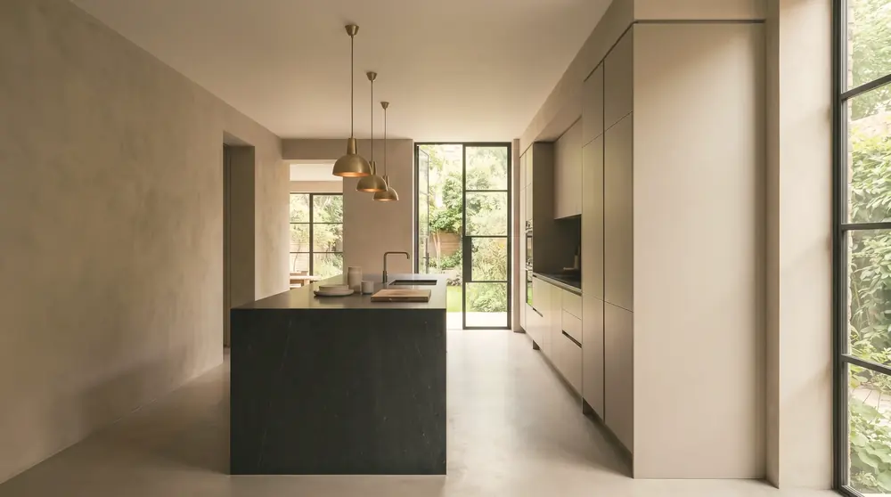 Renovated London kitchen by PrimeCraft Surface Solutions — in-frame cabinetry, stone worktop, island and a rear rooflight.