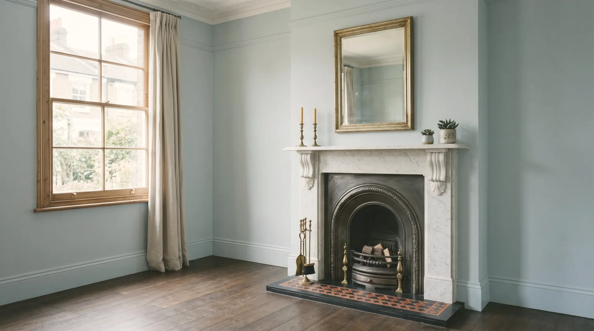 Newly refurbished open-plan London home interior with fitted kitchen, timber flooring and freshly decorated walls after a full strip-out renovation.